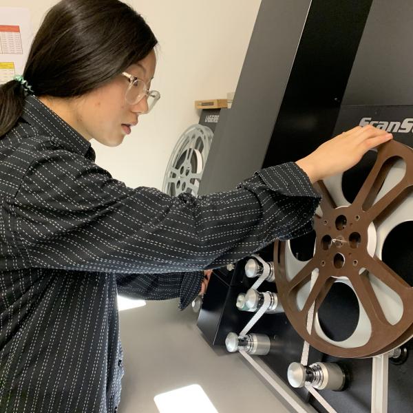 Summer Work Experience Program student, Arvin Zhang, setting up the film scanner.