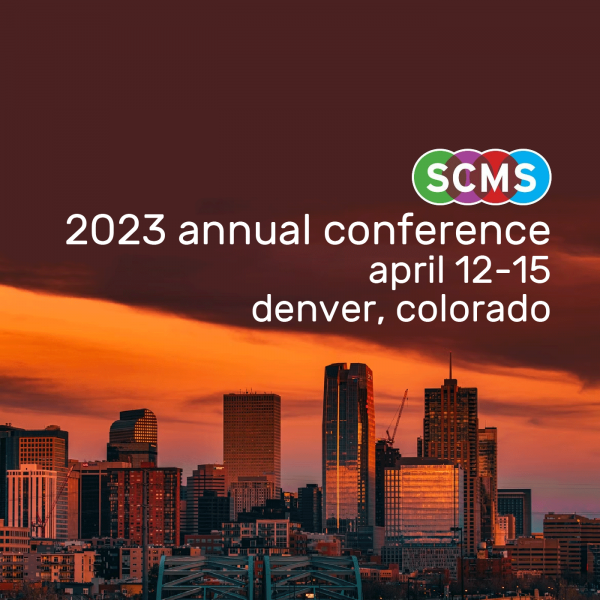 A promotional image with a photograph of downtown Denver during the evening with a colourful logo that says "SCMS" in the middle of the image with the text "2023 annual conference, april 12-15, denver, colorado" underneath it.