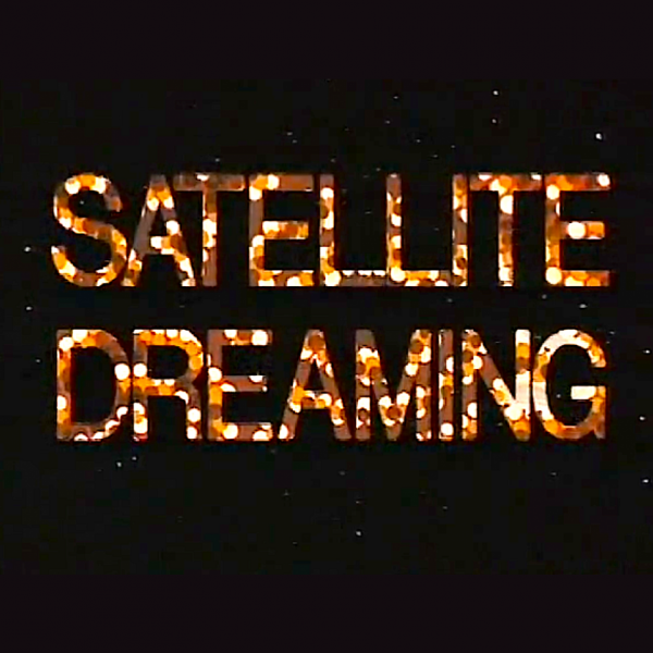 A logo image where the words "SATELLITE DREAMING" are displayed in an orange, all-caps, stylized block font over top of a night sky.